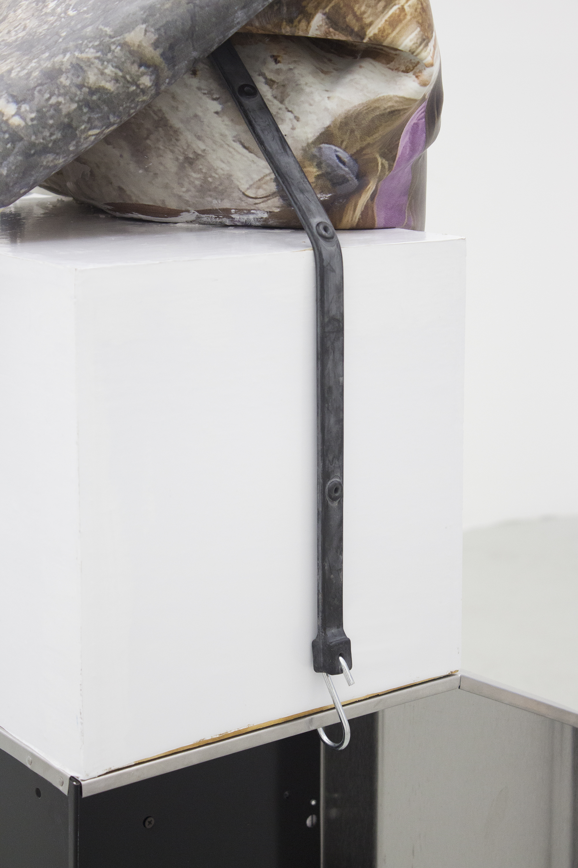 Ashley Carter Too Folds (Detail), 2015 Oven hood, vehicle wrap, plaster, digital print on silicone, and wood
