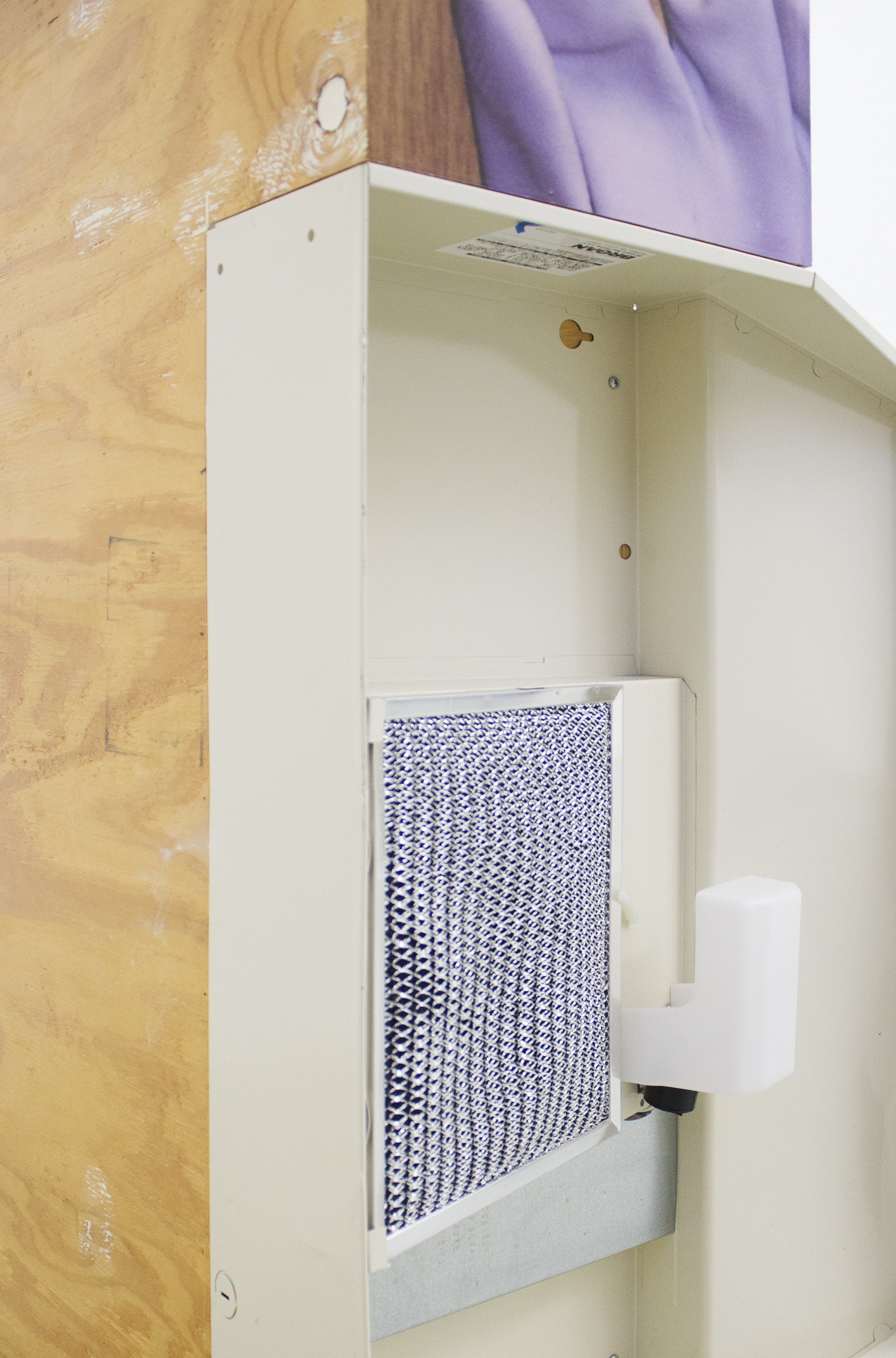 Ashley Carter Hardbody (Detail), 2014 Oven hood, vehicle wrap, cement, auto wax, cigarettes, and wood