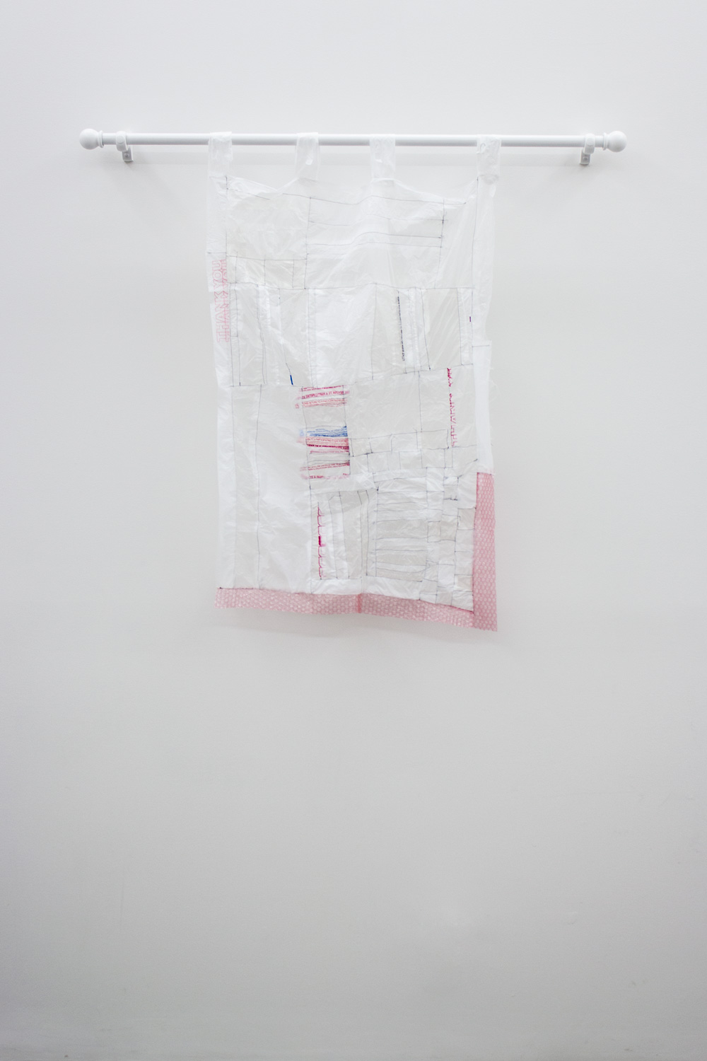 Athena Denos i feel a dark wind, 2014 Plastic bags, bubble wrap, thread, curtain rod