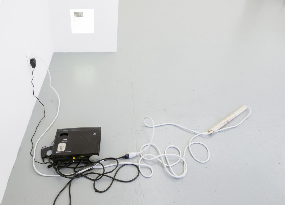 Megan Plunkett Memories 01 - 02, 2015 Video 7m52s looped, projector, extension cord, plywood