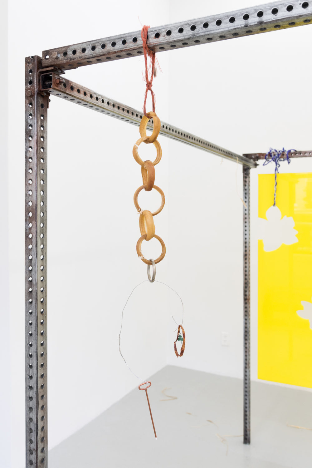 Gunnar Tchida Untitled, 2016 Rawhide, copper, sausage-casing ring, clover earring